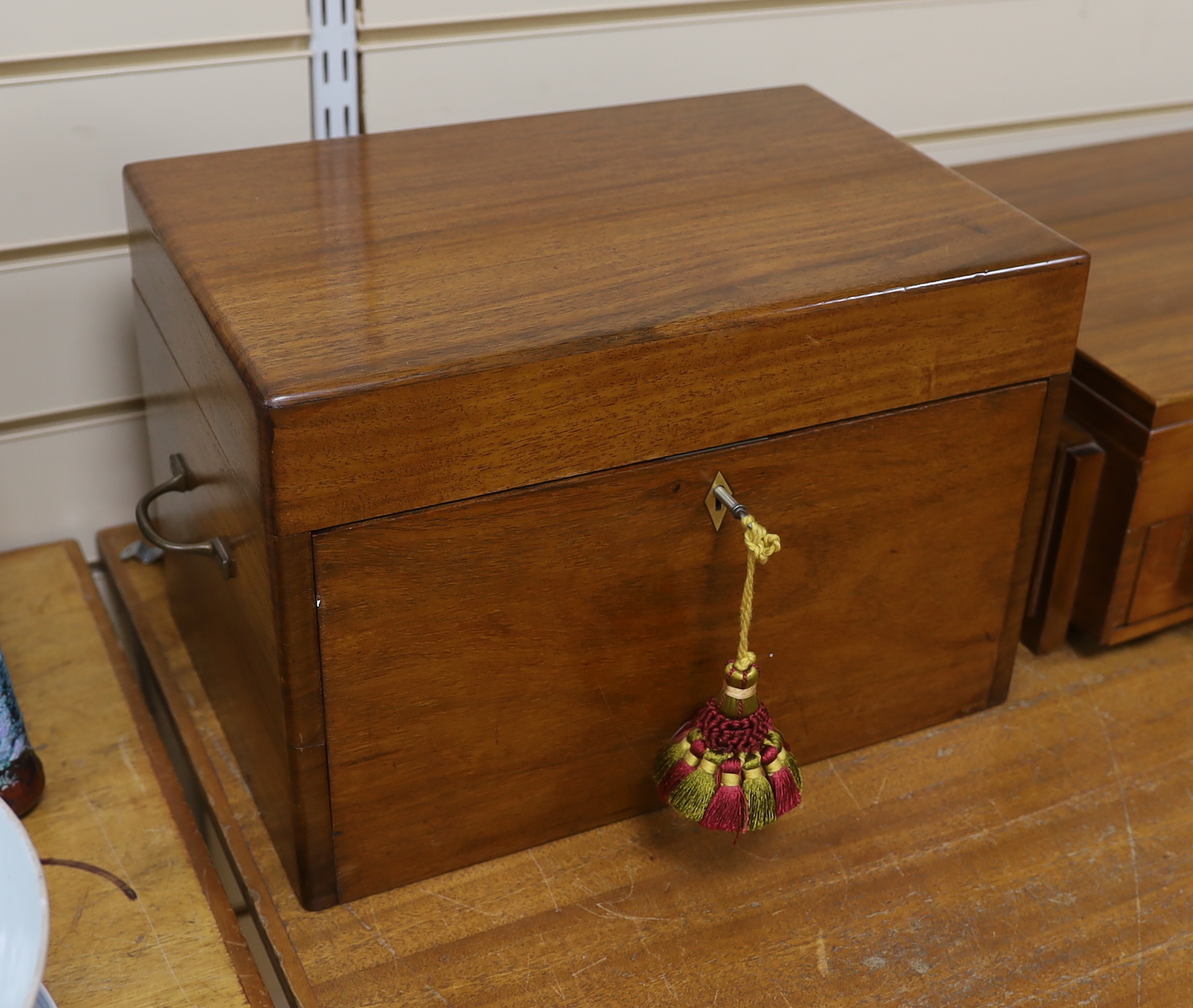 A Victorian mahogany work box, the interior with two drawers, housing a large collection of mostly buttons, a Japanese damascene gilt metal necklace and enamel studs, 42cm wide